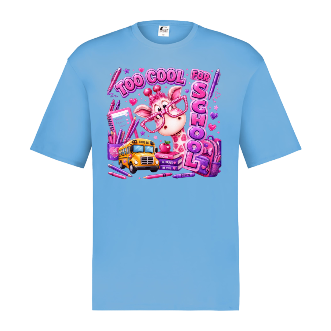 A  columbia blue short-sleeve crewneck t-shirt featuring a colorful graphic print on the front. The graphic shows a pink cartoon pig wearing glasses, a yellow school bus, pink lip gloss, and the text 'TOO COOL FOR SCHOOL' in a bubbly pink font, surrounded by school supplies.