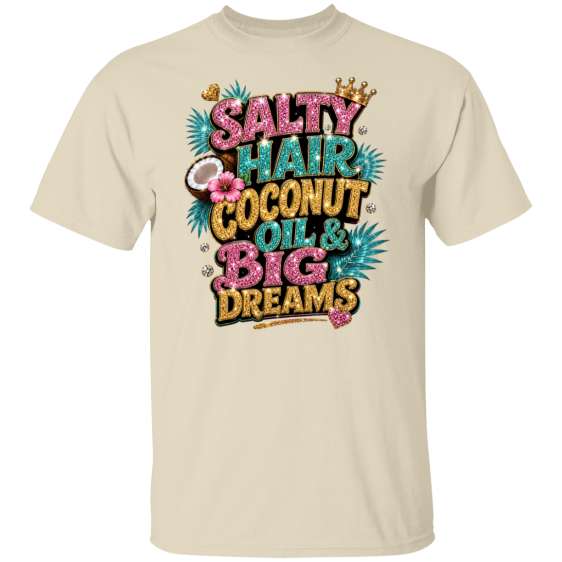 A natural crewneck t-shirt featuring a colorful graphic print on the front with the text 'SALTY HAIR COCONUT OIL & BIG DREAMS' in pink, teal, and gold glitter-style lettering, decorated with a crown, palm leaves, and a coconut.