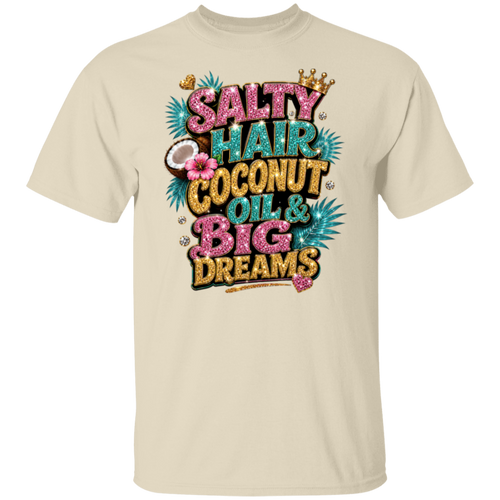 A natural crewneck t-shirt featuring a colorful graphic print on the front with the text 'SALTY HAIR COCONUT OIL & BIG DREAMS' in pink, teal, and gold glitter-style lettering, decorated with a crown, palm leaves, and a coconut.