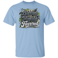 A light blue short-sleeve crewneck t-shirt featuring a large graphic print on the chest with the words 'Blessed and Highly Favored' in stylized lettering, decorated with butterflies, flowers, and green leaves and small birds.