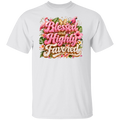 A white color short-sleeve crewneck t-shirt featuring a colorful graphic print on the chest with the text 'Blessed and Highly Favored' in pink and gold lettering, surrounded by tropical flowers and green leaves.