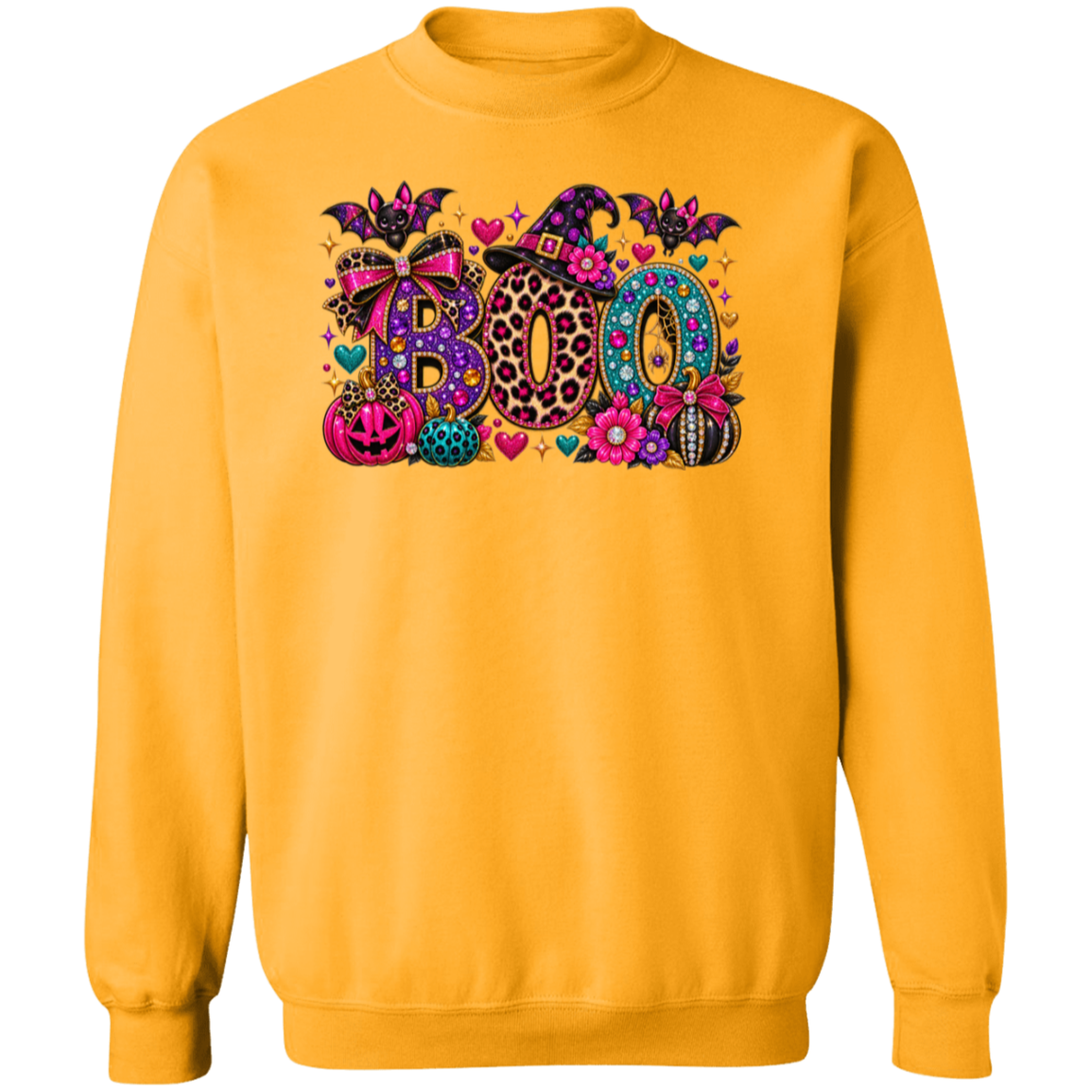 A gold crewneck sweatshirt featuring a colorful 'BOO' graphic with Halloween-themed patterns like leopard print, polka dots, and lace, along with pumpkins, bats, and hearts.