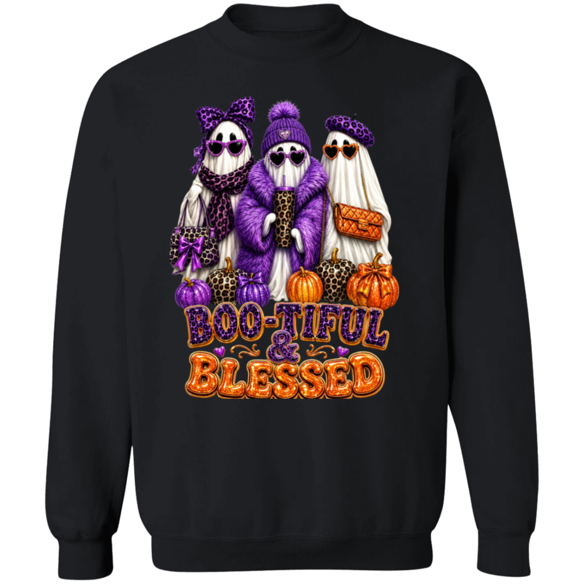 A black crewneck sweatshirt featuring a graphic of three ghosts dressed in purple and leopard-print Halloween costumes, standing next to pumpkins with the text 'BOO-TIFUL & BLESSED' in orange and purple.