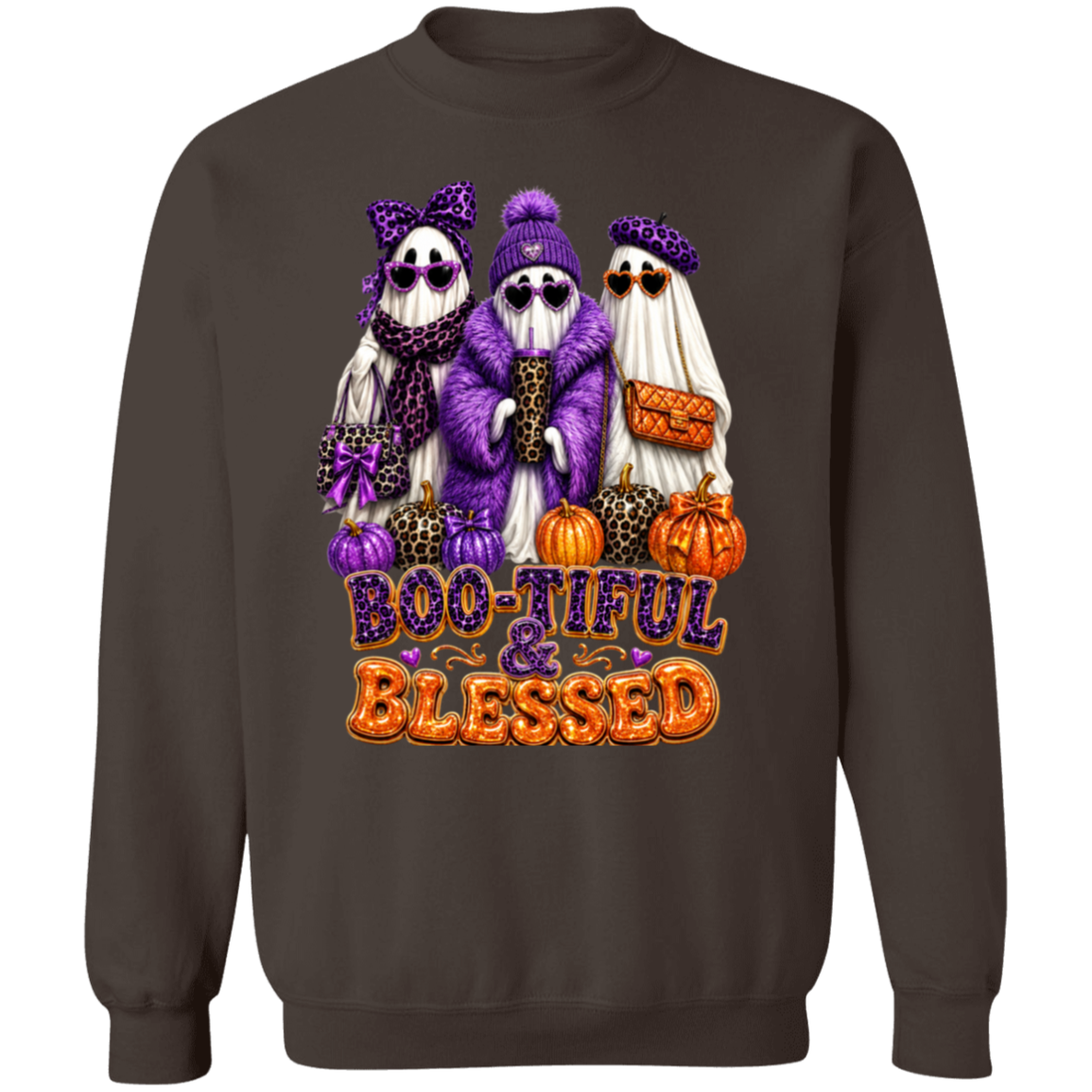 A dark chocolate color crewneck sweatshirt featuring a colorful graphic of three cute cartoon ghosts dressed in purple leopard-print clothing, standing next to pumpkins with the text 'BOO-TIFUL & BLESSED' in purple and orange.