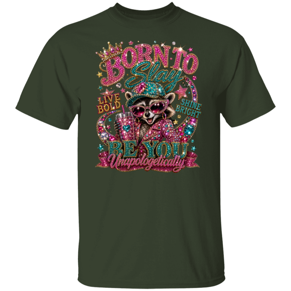 A dark forest green short-sleeve t-shirt with a large, colorful graphic print on the front. The graphic features a raccoon wearing sunglasses and a hat, surrounded by glittery text that reads 'BORN TO Be YOU Unapologetically' along with 'LIVE BOLD' and 'STUNGE BOLD'.