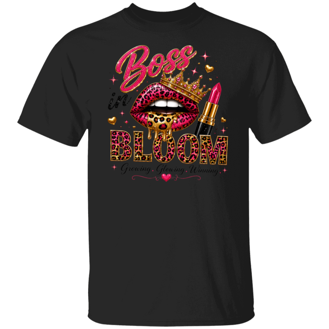 A black short-sleeve crewneck t-shirt featuring a vibrant graphic print on the front. The design includes the words 'Boss is BLOOM' in pink and leopard-print lettering, accompanied by a pair of leopard-print lips wearing a gold crown, a pink lipstick tube, and small gold hearts.