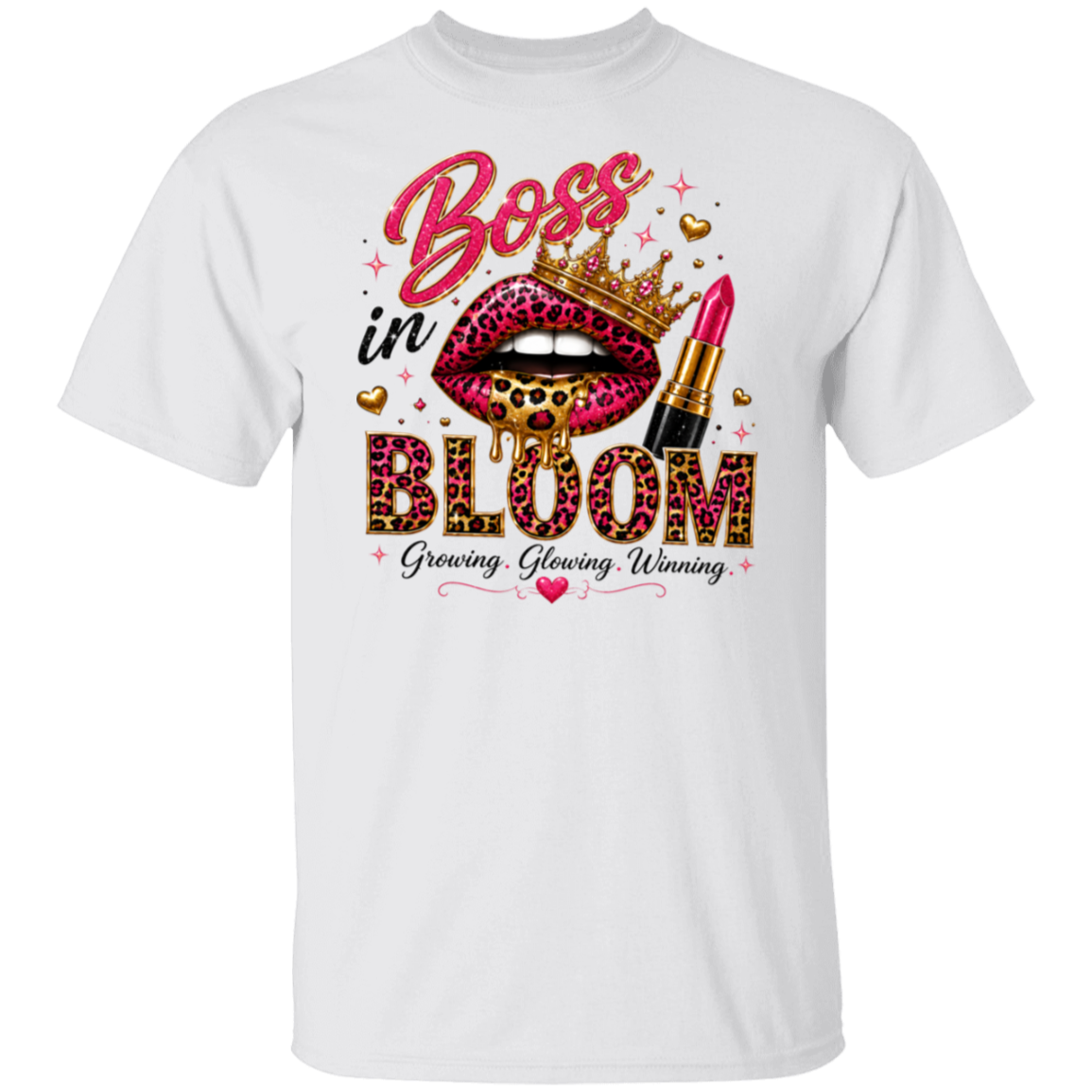A white short-sleeve crewneck t-shirt featuring a colorful graphic print on the front. The graphic displays a pink leopard-print lip wearing a gold crown, a pink lipstick tube, and the text 'Boss in BLOOM' with 'Growing, Glowing, Winning' underneath.