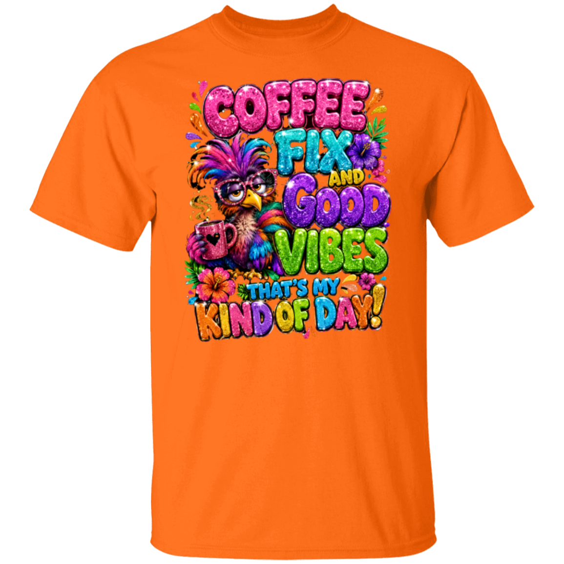 An orange color short-sleeve crewneck t-shirt featuring a colorful graphic print on the front with the text 'COFFEE FIX AND GOOD VIBES THAT'S MY KIND OF DAY!' in vibrant, playful lettering alongside a festive bird character wearing a masquerade mask.