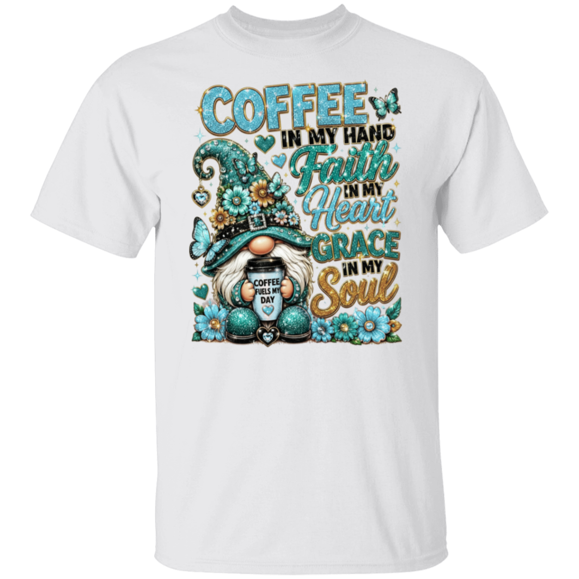 A white short-sleeve crewneck t-shirt featuring a colorful graphic print of a gnome with a coffee mug and the text 'COFFEE IN MY HAND Faith IN My Heart GRACE IN My Soul' in teal and gold lettering.