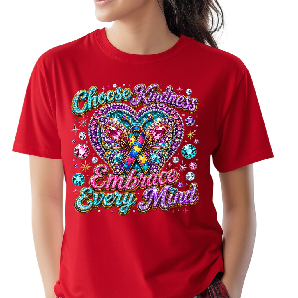 A red short-sleeve crewneck t-shirt featuring a colorful graphic design with a glittery butterfly, rhinestone hearts, and the text 'Choose Kindness Embrace Every Mind'. The shirt is modeled on a person against a plain white background.