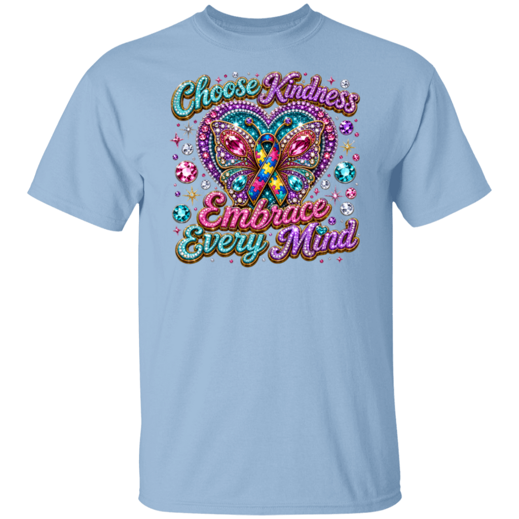 A light blue short-sleeve crewneck t-shirt featuring a colorful graphic on the front. The graphic displays a glittery butterfly with a teal and orange awareness ribbon inside its wings, surrounded by sparkling gem details and the text 'Choose Kindness Embrace Every Mind' in a stylized, multi-colored font.