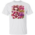 A white short-sleeve crewneck t-shirt featuring a colorful graphic print of a cute cartoon cow wearing pink glasses and a pink sweater, surrounded by flowers and butterflies, with the text 'Stay Positive Enjoy Your Coffee'.