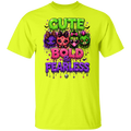 A safety green short-sleeve t-shirt with a colorful graphic print on the front featuring cartoon cats and the text 'CUTE BOLD & FEARLESS' in dripping neon colors.