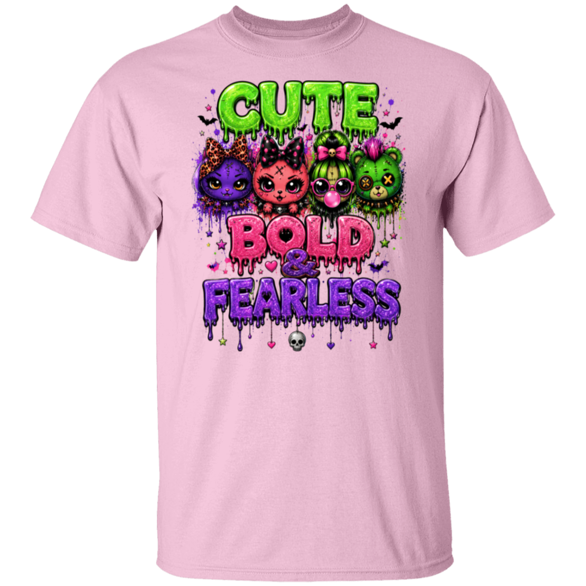 A light pink short-sleeve crewneck t-shirt featuring a colorful graphic print on the front with the text 'CUTE BOLD & FEARLESS' and cartoon cats in purple, pink, and green with slime drips.
