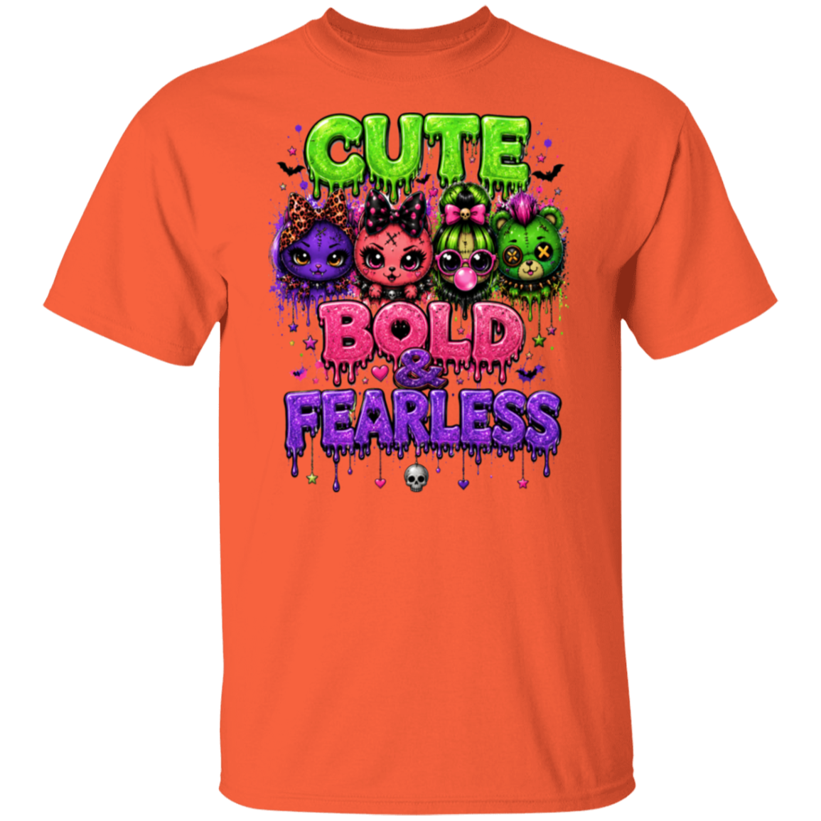 An orange short-sleeve crewneck t-shirt featuring a colorful graphic print on the front with the text 'CUTE BOLD & FEARLESS' and cartoon cat characters in purple, pink, and green.