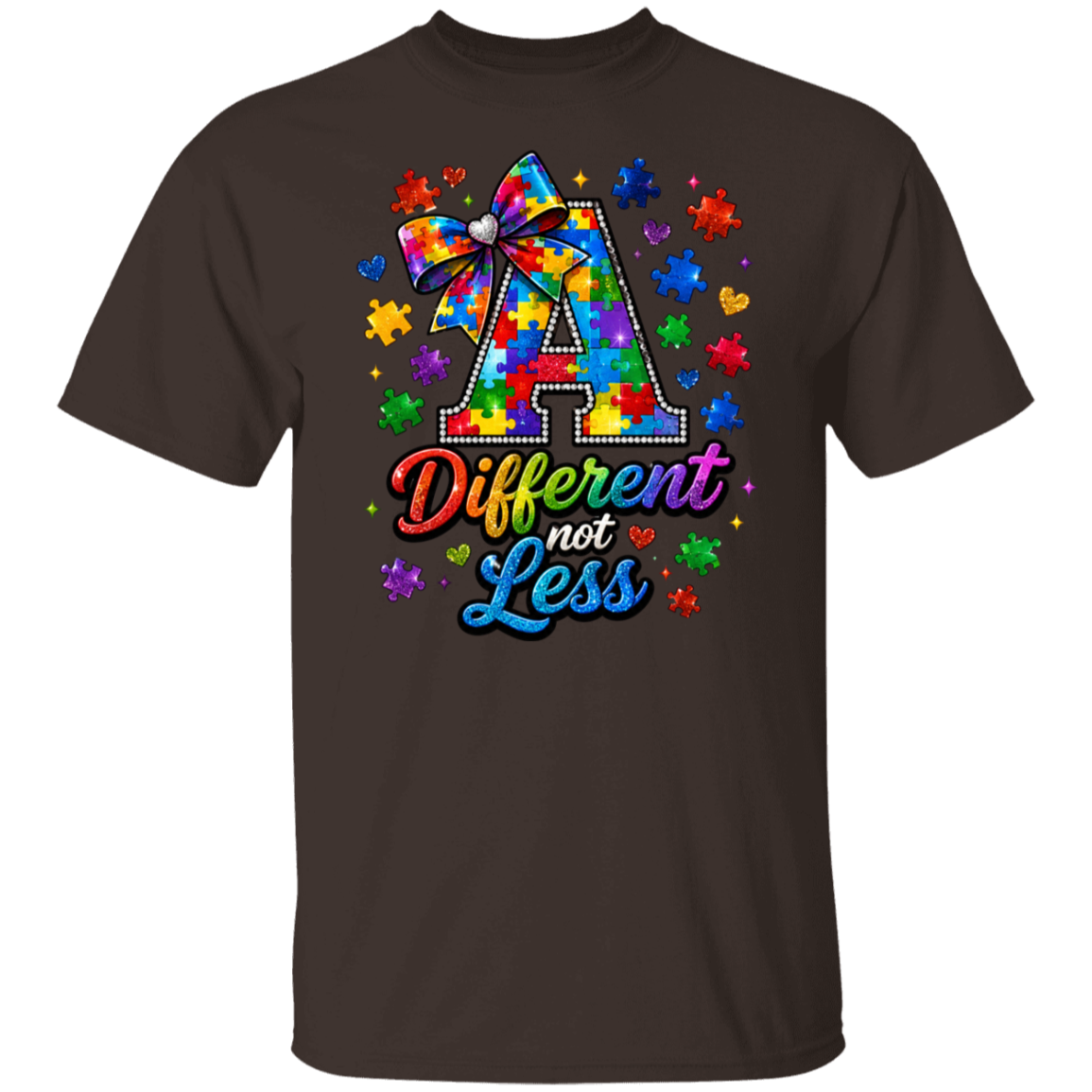 A dark chocolate color short-sleeve crewneck t-shirt featuring a colorful graphic on the chest. The graphic displays a large letter 'A' filled with a tie-dye puzzle pattern and a ribbon bow, surrounded by puzzle pieces and hearts, with the text 'Different not Less' written below in a rainbow gradient.