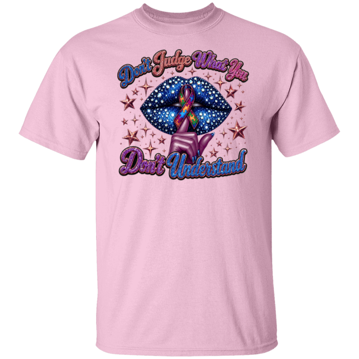 A light pink short-sleeve crewneck t-shirt featuring a graphic design on the front. The design shows a blue starry lips motif with a purple and rainbow awareness ribbon, surrounded by small gold stars, with the text 'Don't Judge What You Don't Understand' in a stylized purple and blue font.