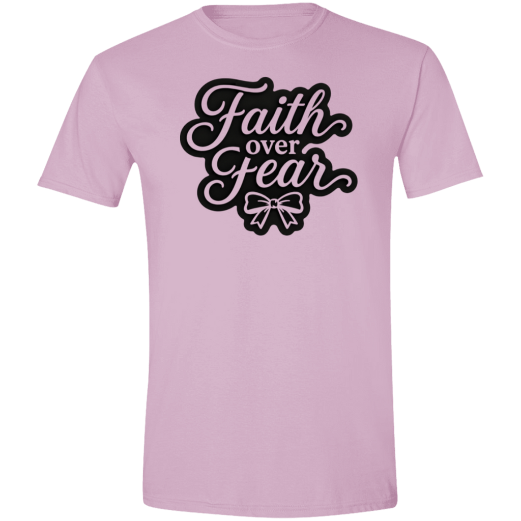 A light pink short-sleeve crewneck t-shirt featuring a black graphic on the chest that reads 'Faith over Fear' in a stylized cursive font with a bow illustration underneath.