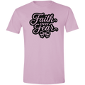 A light pink short-sleeve crewneck t-shirt featuring a black graphic on the chest that reads 'Faith over Fear' in a stylized cursive font with a bow illustration underneath.