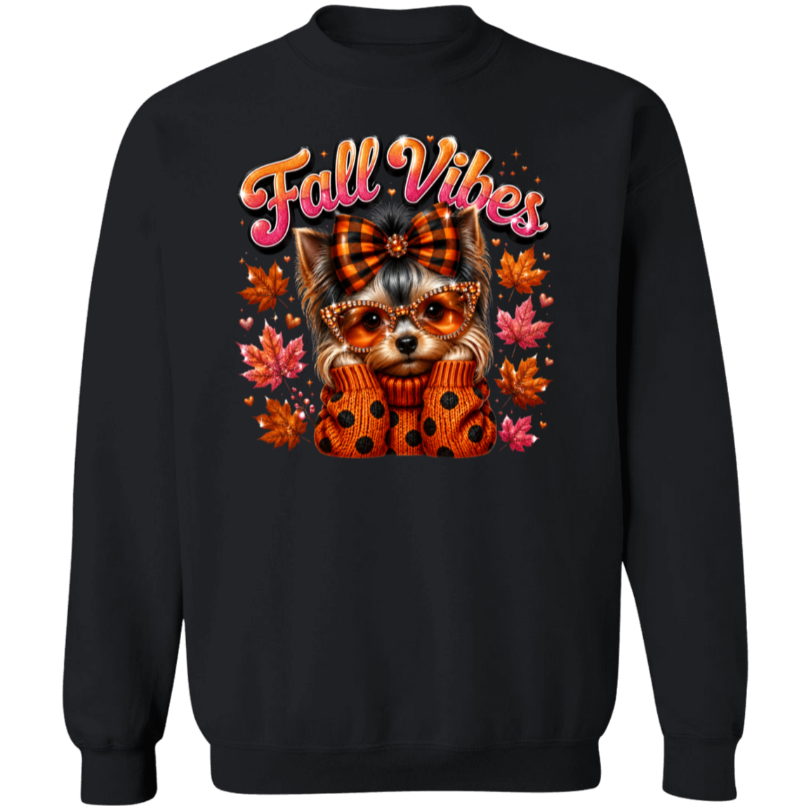 A black crewneck sweatshirt featuring a colorful graphic of a small dog wearing a plaid bow and polka-dot sweater, surrounded by autumn leaves, with the text 'Fall Vibes' in orange and pink above it.