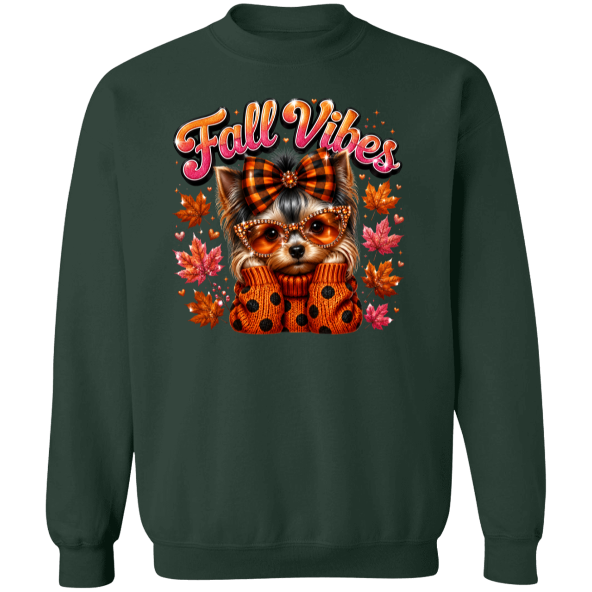 A forest green crewneck sweatshirt featuring a colorful graphic of a small dog wearing a plaid bow and sunglasses, wrapped in a polka-dot sweater, surrounded by autumn leaves and the text 'Fall Vibes'.