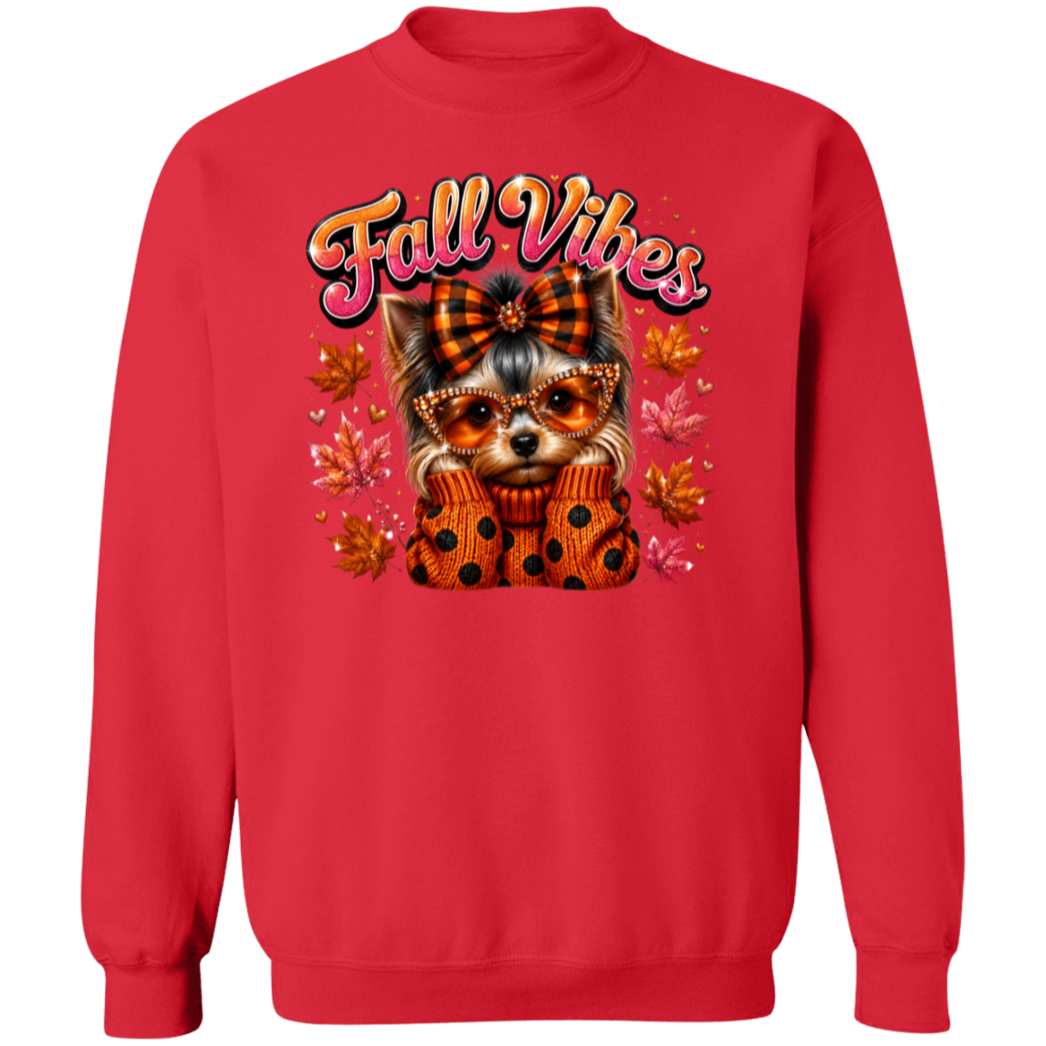 A red crewneck sweatshirt featuring a graphic of a small dog wearing an orange plaid bow and matching polka-dot sweater, surrounded by autumn leaves and the text 'Fall Vibes' in a retro pink font.