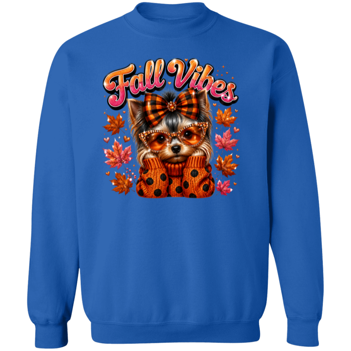 A royal blue crewneck sweatshirt featuring a colorful graphic of a small dog wearing a plaid bow and sunglasses, wrapped in a polka-dot sweater, surrounded by autumn leaves and the text 'Fall Vibes'.