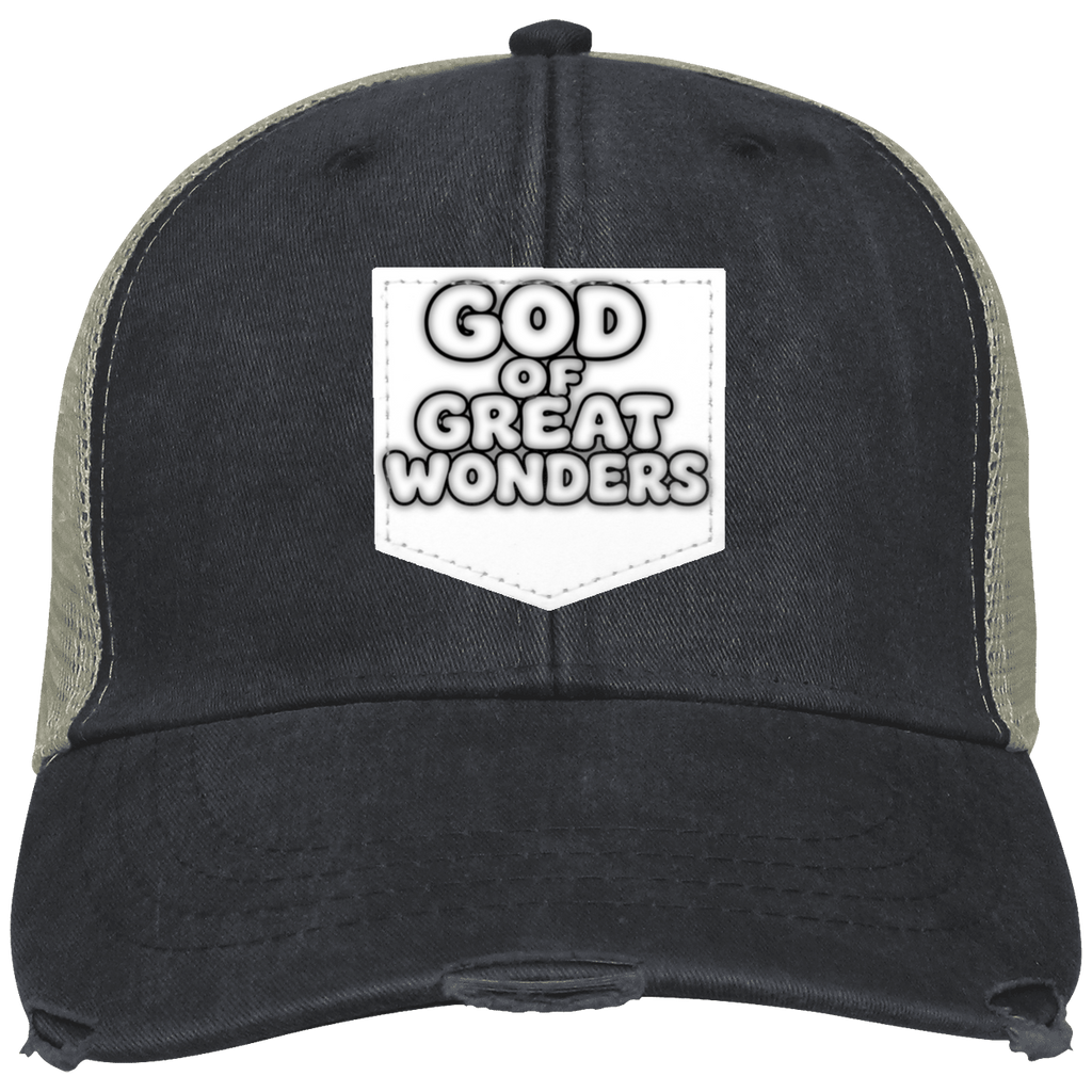 A distressed trucker hat with a washed black front panel and brim, olive green mesh side panels, and a white front patch reading 'GOD OF GREAT WONDERS'.