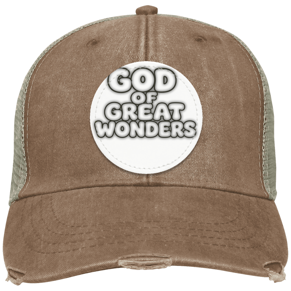 A brown distressed trucker hat with a white circular patch on the front that reads 'GOD OF GREAT WONDERS' in black and white lettering. The side panels are made of a muted olive green mesh.
