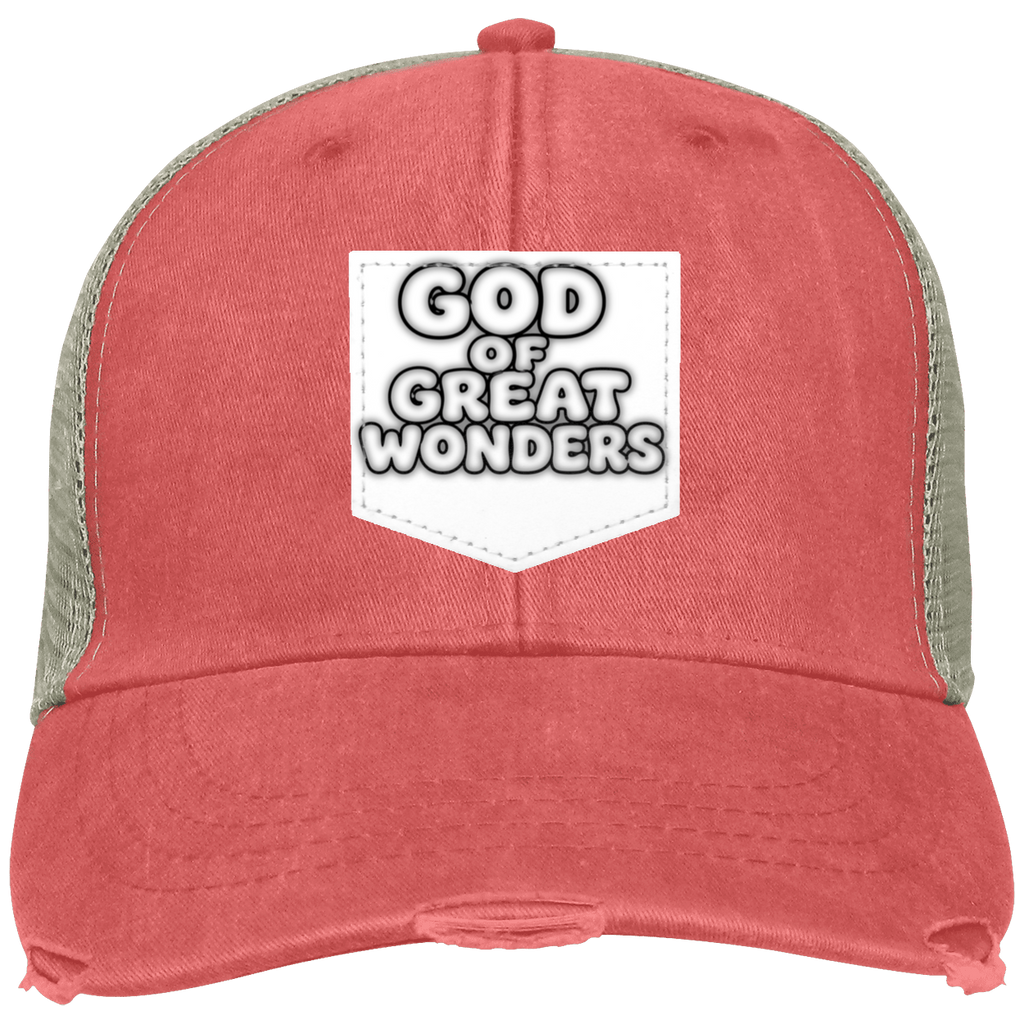 A distressed trucker hat in a washed coral red color with sage green mesh back panels. The front features a white shield-shaped patch with the text 'GOD OF GREAT WONDERS' in a bold black and white font.