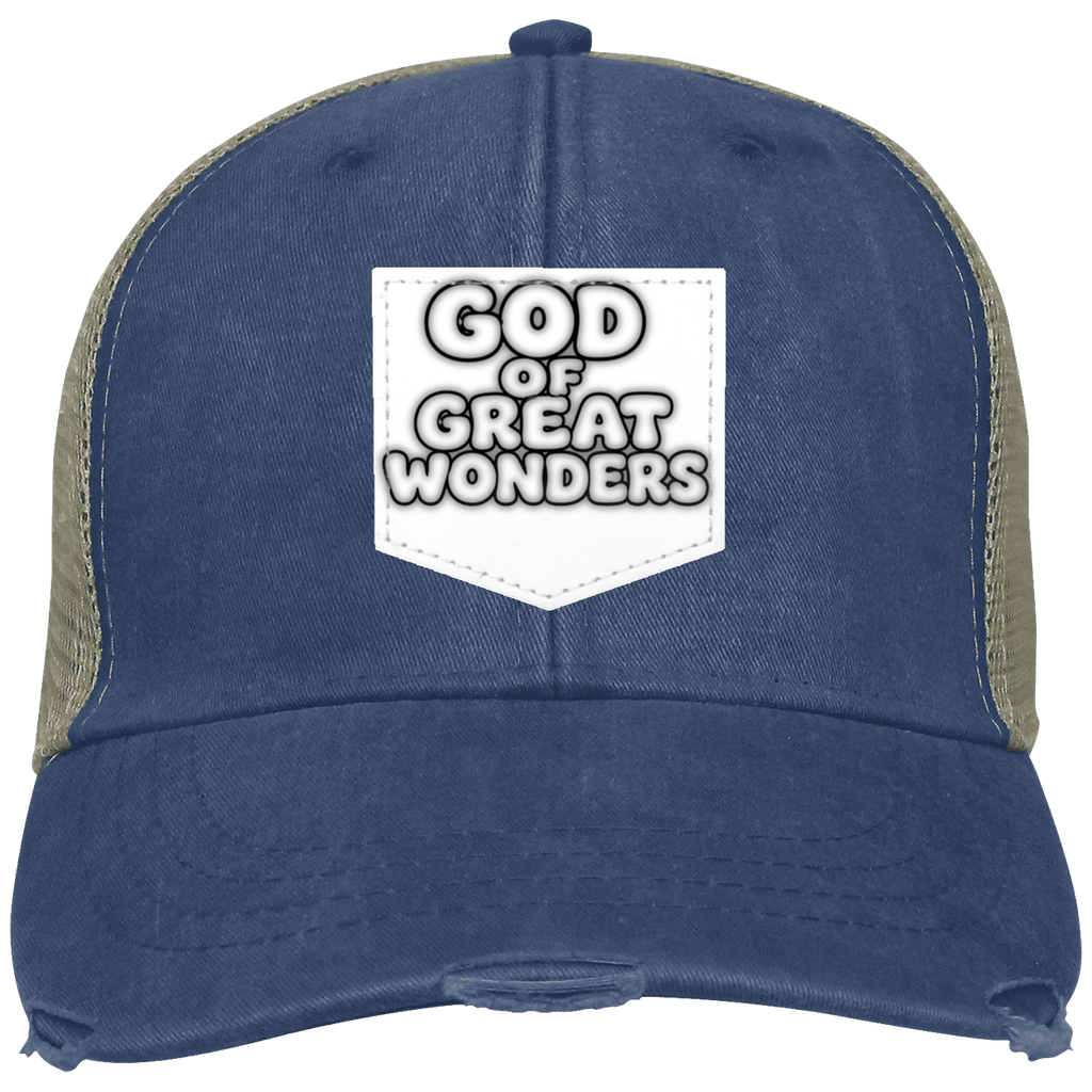 A distressed trucker hat in navy blue with olive green mesh side panels and a white front patch reading 'GOD OF GREAT WONDERS'.