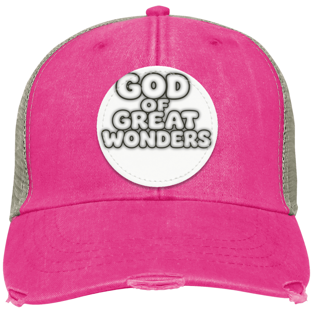 A distressed trucker hat in vibrant pink/tan color with a gray mesh back, featuring a circular white patch on the front that reads 'GOD OF GREAT WONDERS' in bold black and white lettering.