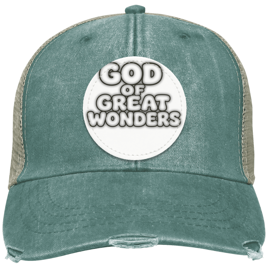 A distressed trucker hat in washed teal green with beige mesh side panels and a white circular patch on the front that reads 'GOD OF GREAT WONDERS'.