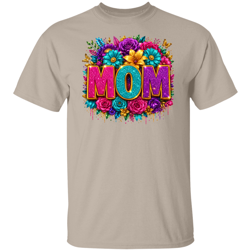 A sand color crewneck t-shirt featuring a colorful graphic print on the front with the word 'MOM' in 3D letters surrounded by vibrant flowers.