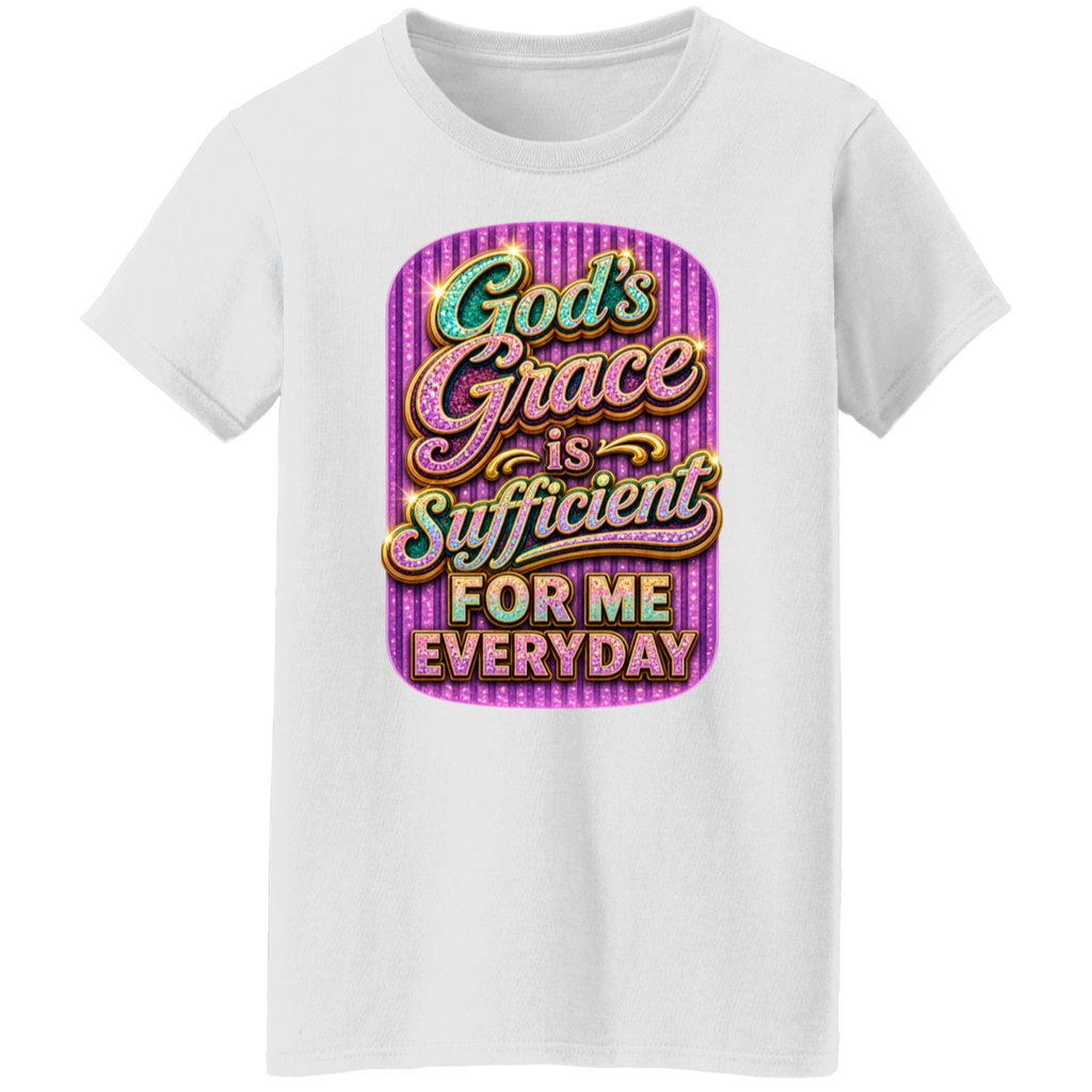 A white short-sleeve crewneck t-shirt featuring a colorful graphic print on the front. The graphic has a purple striped background and displays the text 'God's Grace is Sufficient FOR ME EVERYDAY' in stylized, glittery fonts.