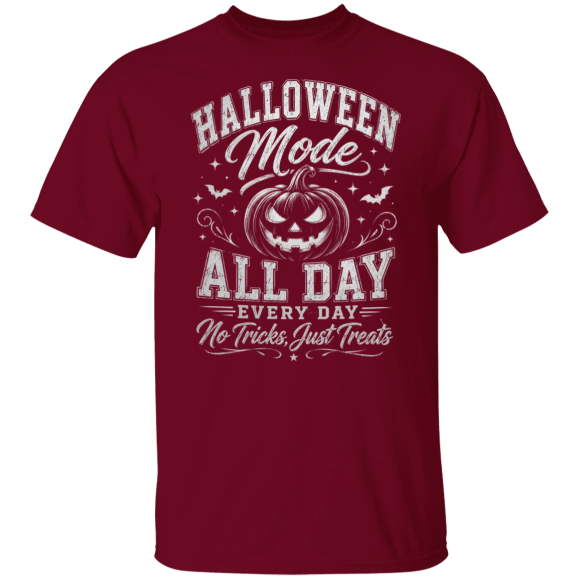 A garnet color short-sleeve crewneck t-shirt with a white graphic print on the front that reads 'HALLOWEEN Mode ALL DAY EVERY DAY No Tricks, Just Treats' surrounding a jack-o'-lantern illustration.