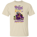 A natural color crewneck t-shirt featuring a colorful graphic of an elderly woman in a purple armchair with the text 'I'M Retired I'M NOT BOSSY I'M THE Queen I'm JUST ENJOYING My New Chapter'.