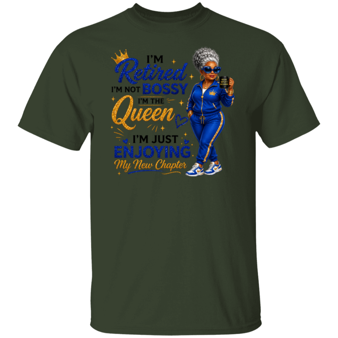 A dark forest green short-sleeve t-shirt with a graphic print on the front. The graphic features a cartoon illustration of a woman in a blue tracksuit holding a phone, surrounded by text that reads 'I'm Retired I'm Not Bossy I'm The Queen I'm Just Enjoying My New Chapter' in blue and gold lettering.