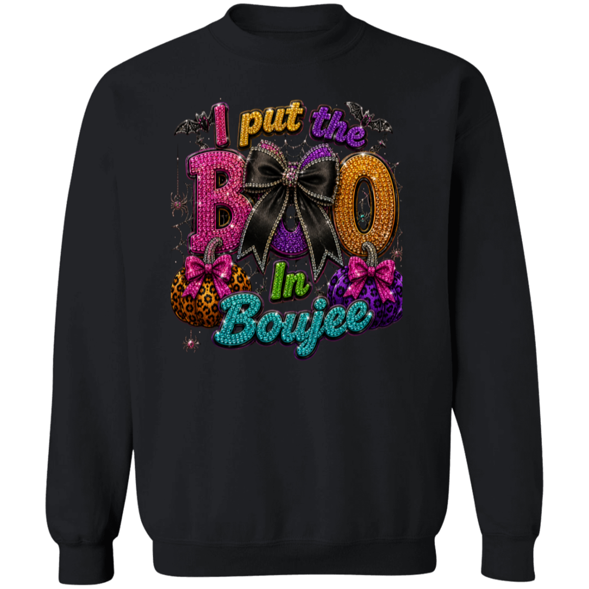 A black crewneck sweatshirt featuring a colorful graphic print on the front with the text 'I put the BOO In Boujee' in glittery, rhinestone-textured fonts alongside decorative bows and gift boxes in Halloween colors.