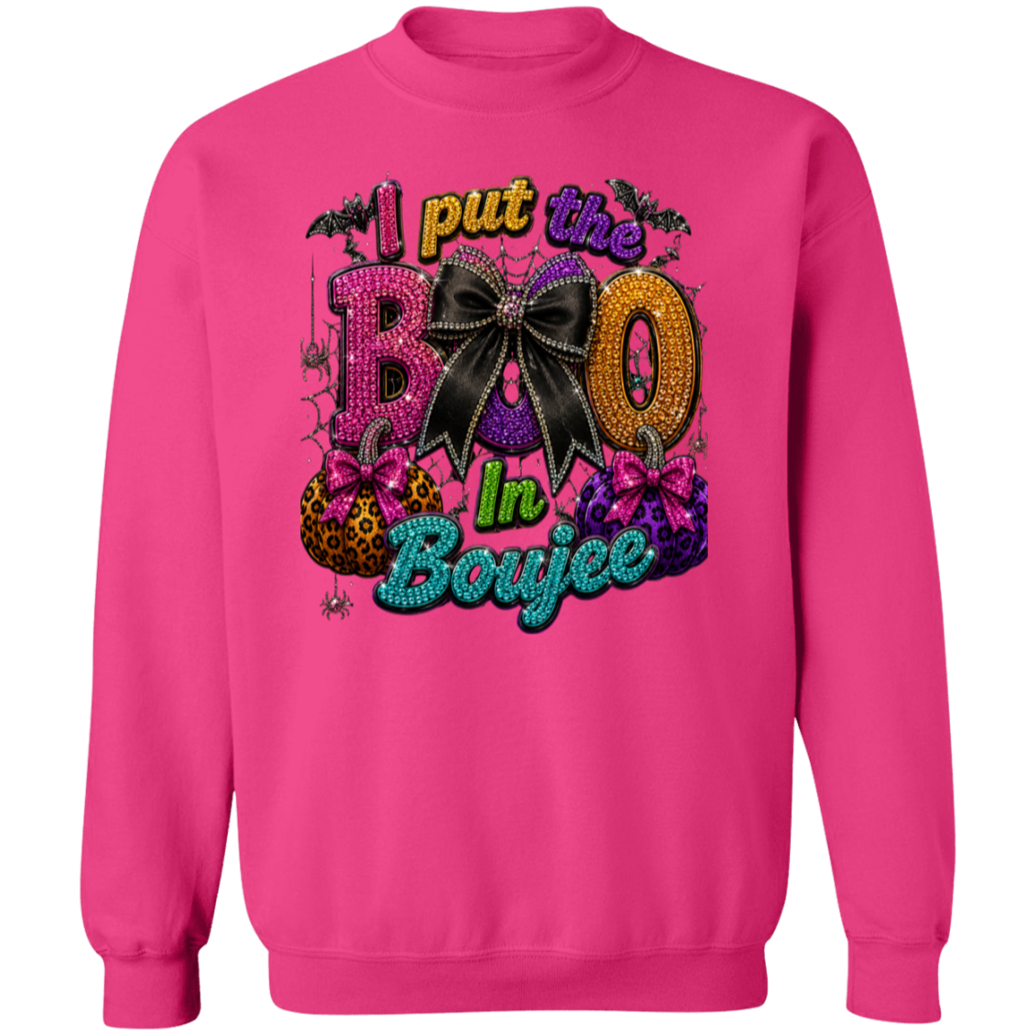A heliconia color crewneck sweatshirt featuring a colorful, Halloween-themed graphic on the chest that reads 'I put the BOO In Boujee' with decorative text, bats, a black bow, pumpkins, and purple crystals.