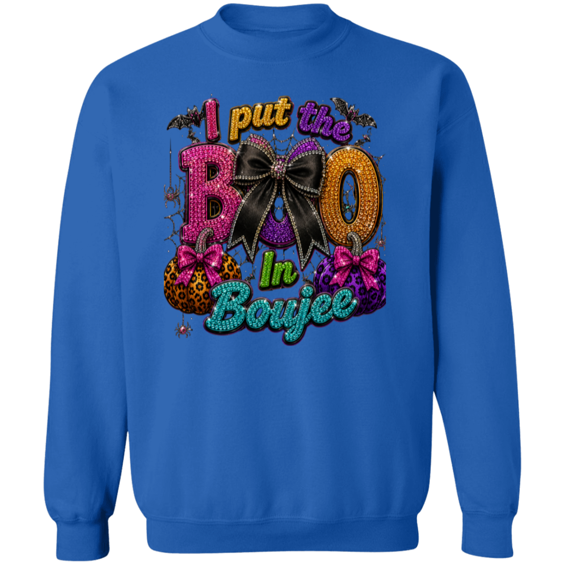 A royal blue crewneck sweatshirt featuring a colorful, glittery graphic on the front that reads 'I put the BOO In Boujee' with bats, pumpkins, and a large black bow.