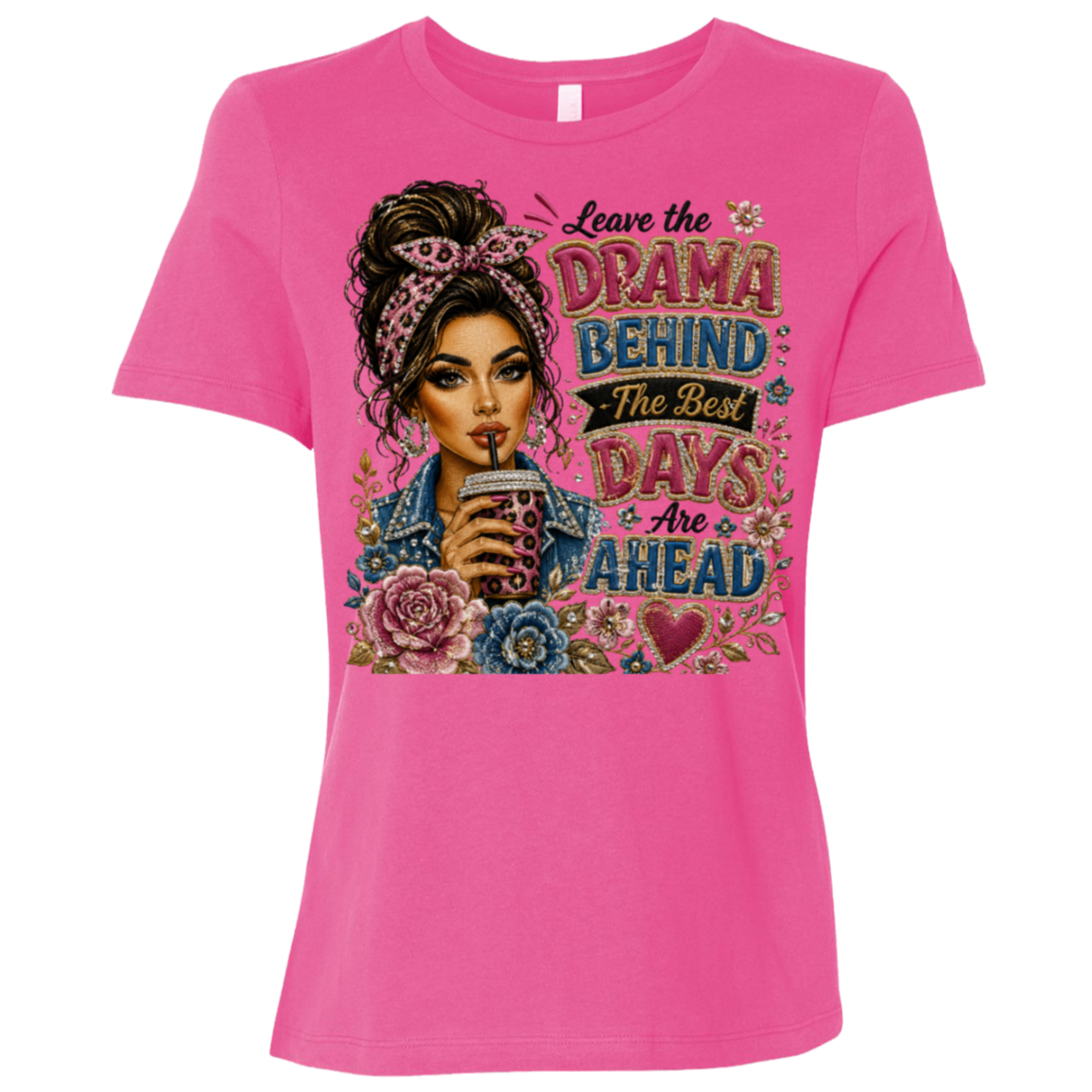 A berry color short-sleeve t-shirt with a colorful graphic print on the front. The graphic features an illustration of a woman with a headband and flowers, holding a cup with straw, next to the text 'Leave the DRAMA BEHIND The Best DAYS Are AHEAD' in stylized fonts.