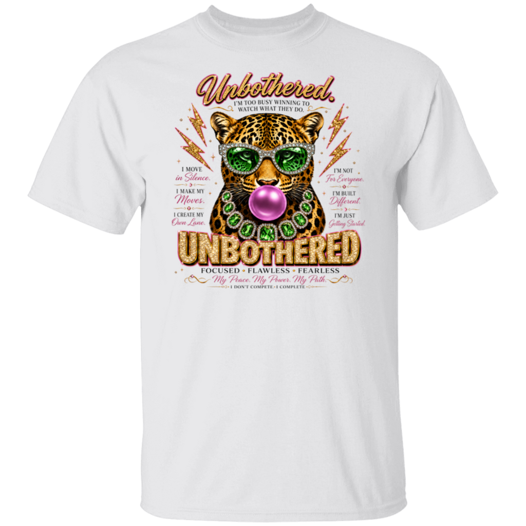 A white short-sleeve crewneck t-shirt featuring a colorful graphic print of a leopard wearing green sunglasses and a green beaded necklace, blowing a pink bubblegum bubble. The graphic includes the words 'Unbothered' and 'UNBOthered' in stylized fonts, surrounded by motivational text.
