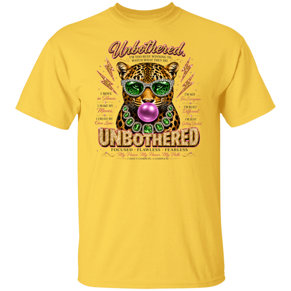 A yellow short-sleeve crewneck t-shirt featuring a colorful graphic print of a leopard wearing green sunglasses and a purple bubblegum mouth, with the words 'Unbothered' and 'UNBOUGHTERED' on a plain white background.