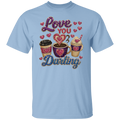 A light blue short-sleeve t-shirt with a rhinestone-style graphic on the front that reads 'Love You Darling' in pink and blue lettering, surrounded by small hearts and three decorated coffee cups.