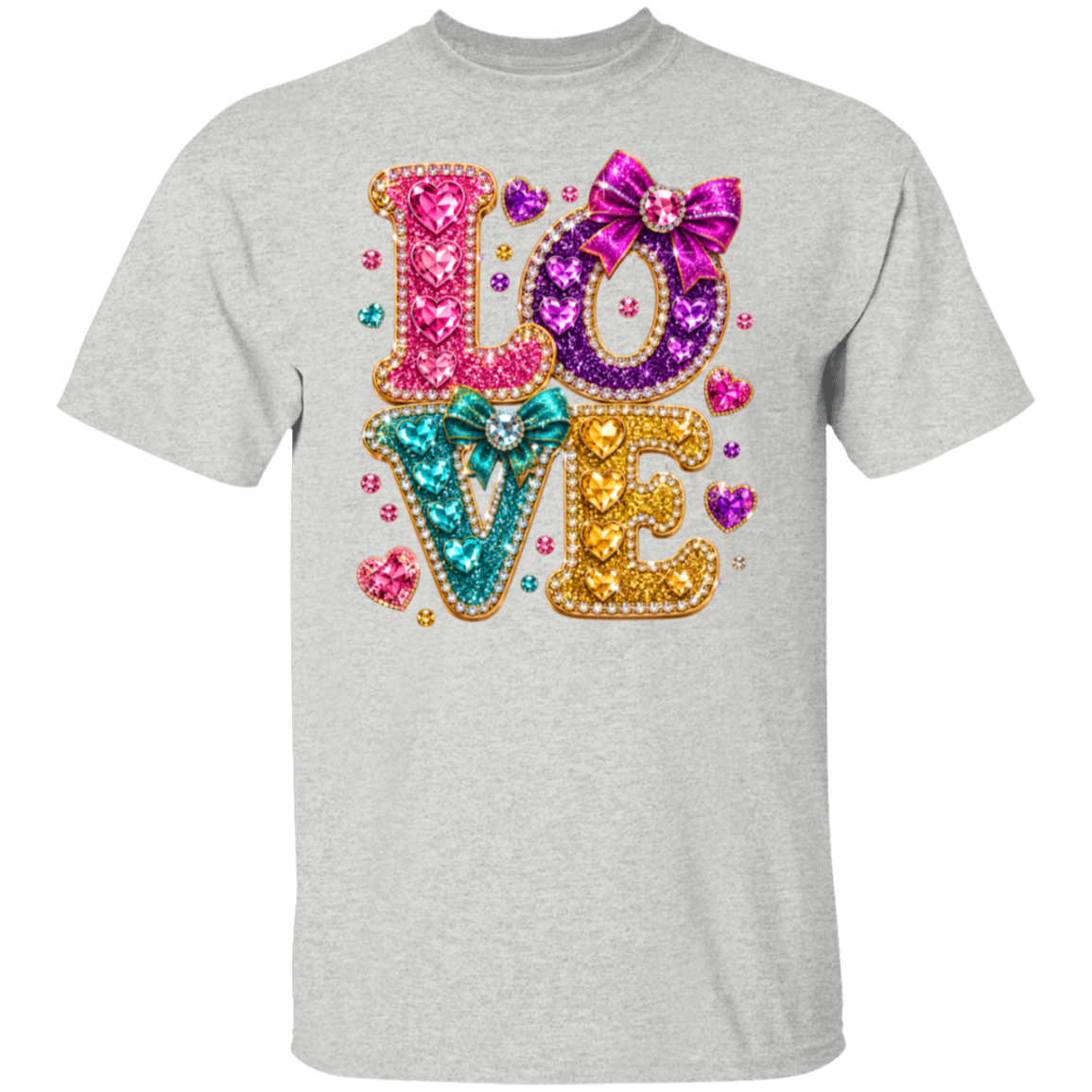 An ash color crewneck t-shirt featuring a large, colorful 'LOVE' graphic on the chest. The letters are filled with glittery textures in pink, purple, teal, and gold, decorated with small rhinestones and bows, set against a plain white background.