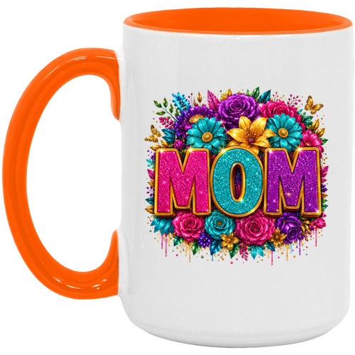 A white ceramic mug with a bright orange handle and interior rim, featuring a colorful floral graphic and the word 'MOM' in glittery pink, teal, and purple letters on the front.