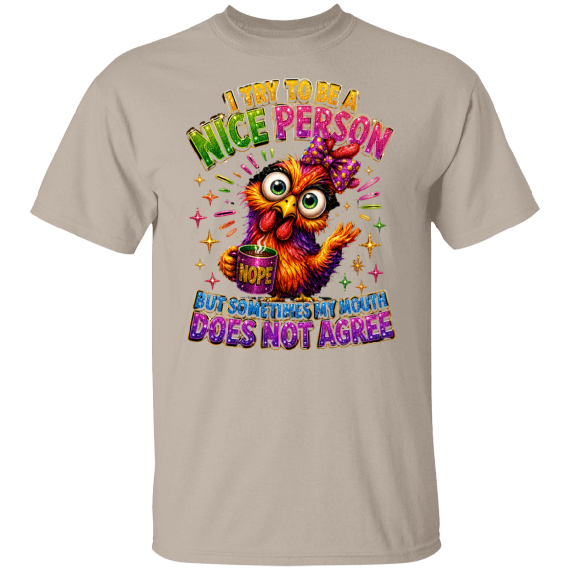 A sand crewneck t-shirt featuring a colorful graphic of a cartoon owl holding a mug that says 'NOPE' under the text 'I TRY TO BE A NICE PERSON BUT SOMETIMES MY MOUTH DOES NOT AGREE'.