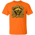 An orange short-sleeve crewneck t-shirt featuring a large graphic print on the front with the text 'On My Way To the Top' in a gold glitter-style font, surrounding an illustration of a mountain peak, sun rays, and a silhouetted figure standing on top.