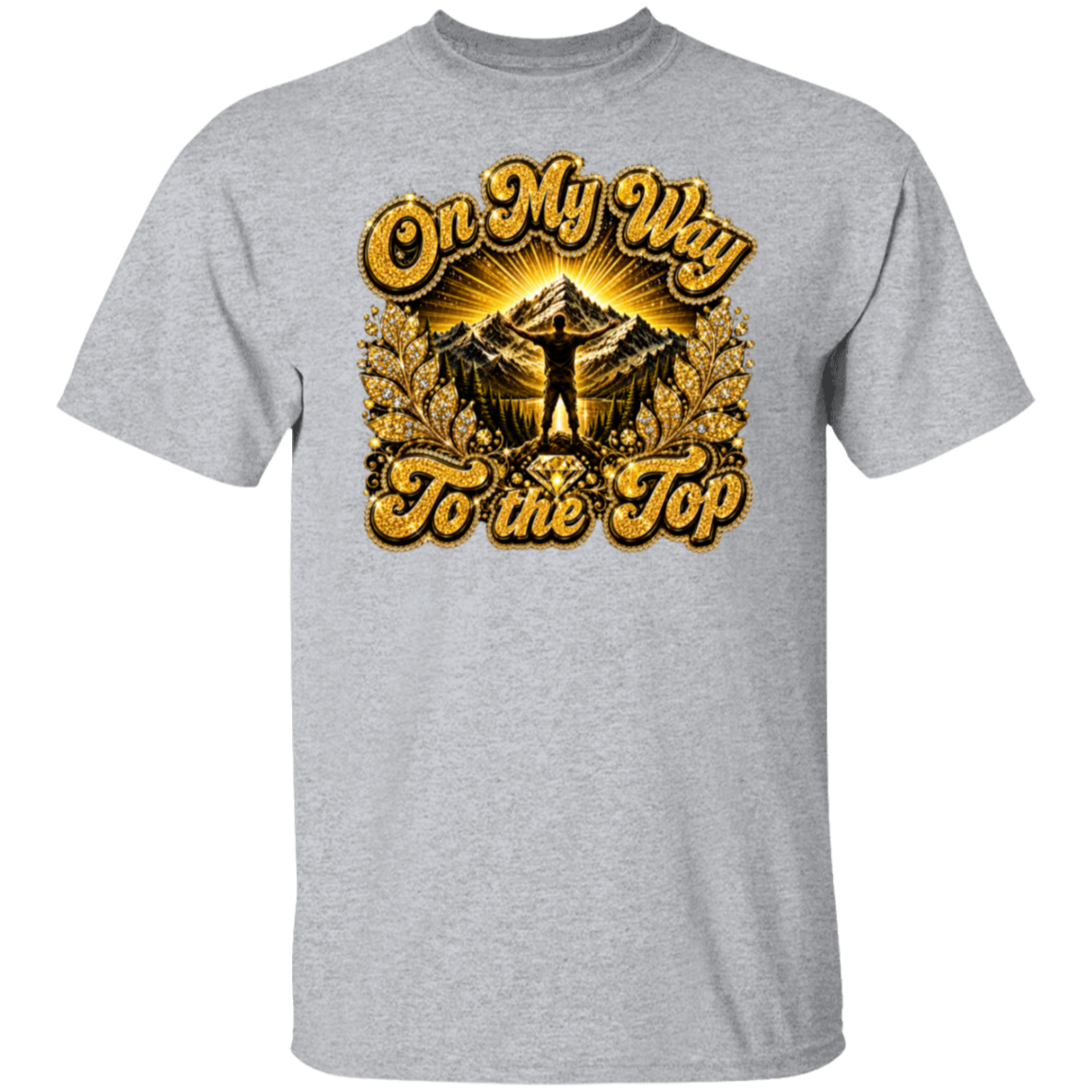 A sport grey short-sleeve crewneck t-shirt featuring a large graphic print on the front. The graphic displays a mountain peak with a silhouette of a person standing on top, surrounded by golden sun rays and the text 'On My Way To the Top' in a textured gold font.